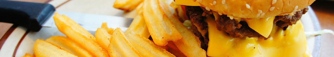 Eating American (Traditional) Burger at Sno-Flake Drive-In restaurant in South Lake Tahoe, CA.